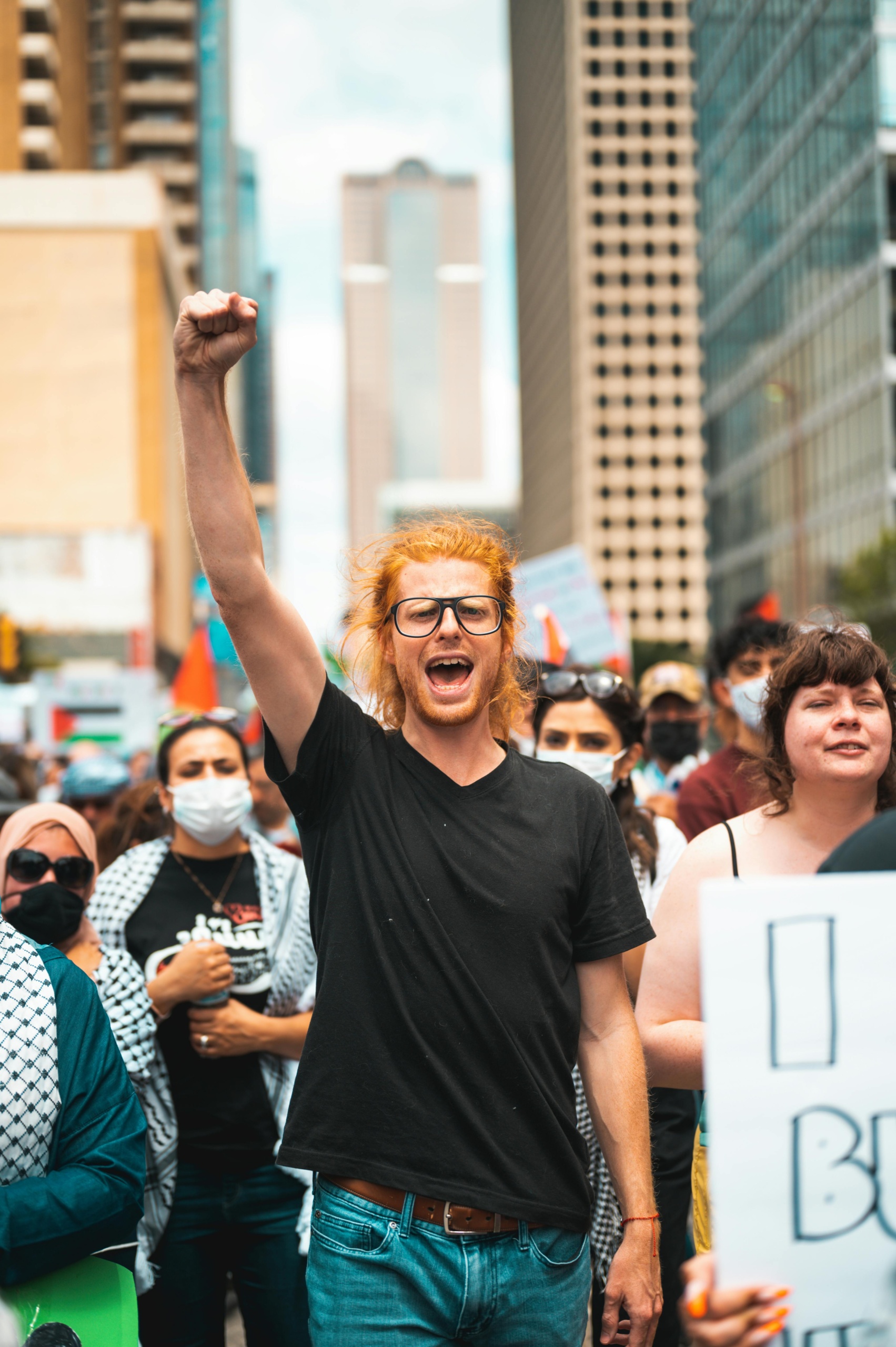 Man raising fist at Palestine protest
